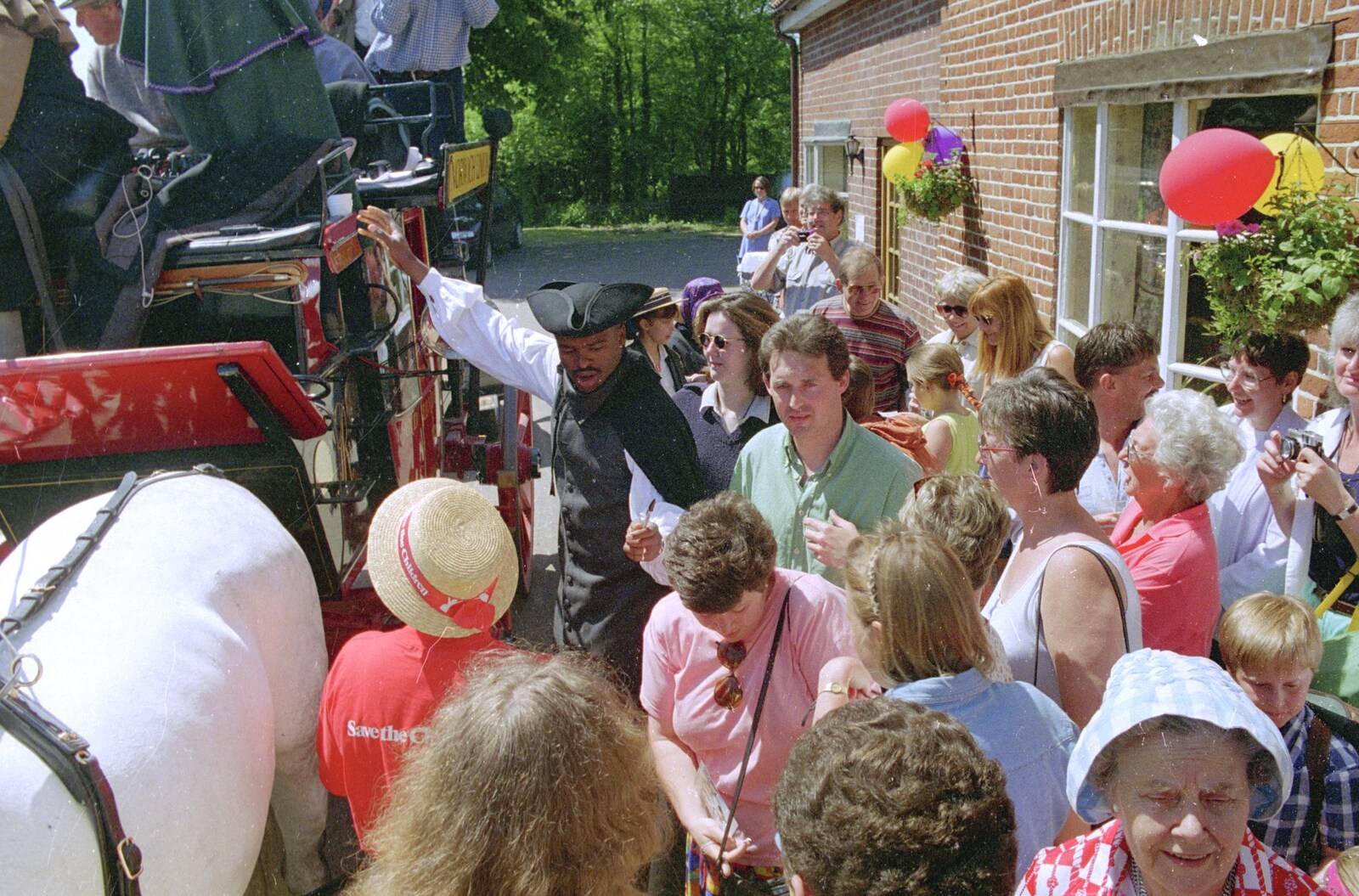 Kris Akabusi and the crowds from The Norwich Union Mail Coach Run, The Swan Inn, Brome - 15th June 1996