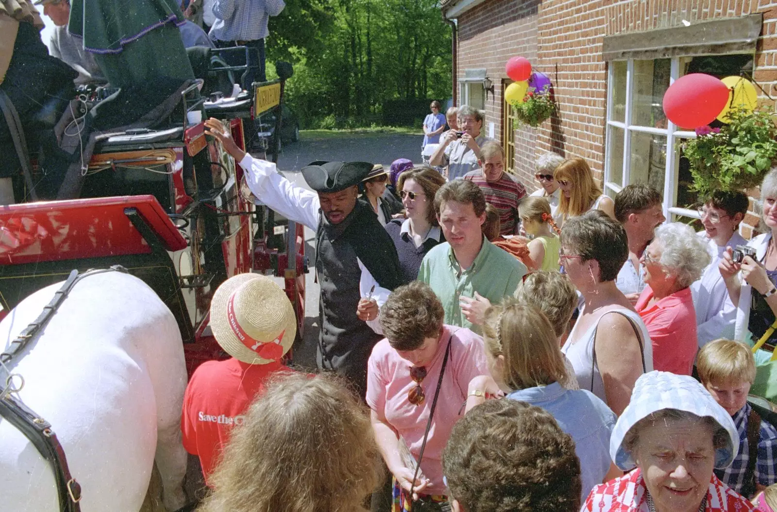 Kris Akabusi and the crowds, from The Norwich Union Mail Coach Run, The Swan Inn, Brome - 15th June 1996