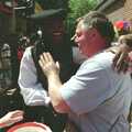 Danny Flint gets a pat on the back from Kris Akabusi, The Norwich Union Mail Coach Run, The Swan Inn, Brome - 15th June 1996