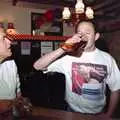 DH has a go on the boot, A Welly Boot of Beer at the Swan Inn, Brome, Suffolk - 15th June 1996