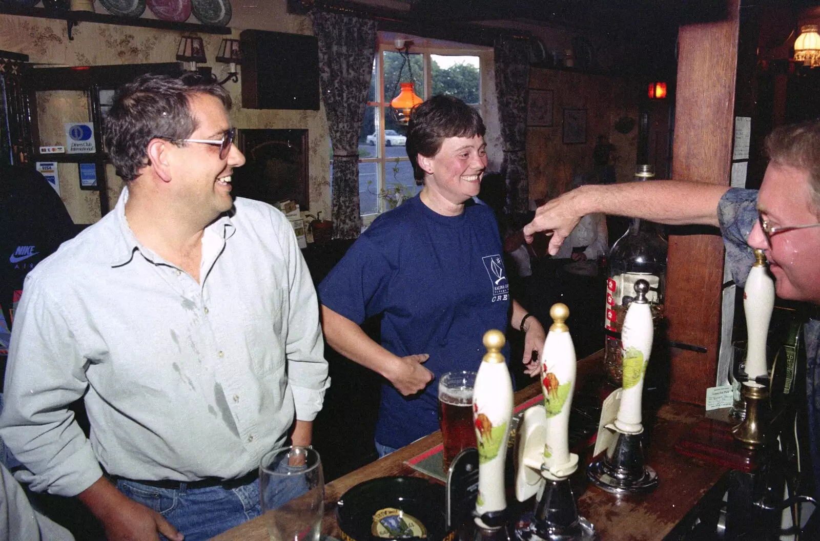 John Willy reaches over to shake the winner's hand, from A Welly Boot of Beer at the Swan Inn, Brome, Suffolk - 15th June 1996