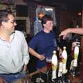 John Willy reaches over to shake the winner's hand, A Welly Boot of Beer at the Swan Inn, Brome, Suffolk - 15th June 1996