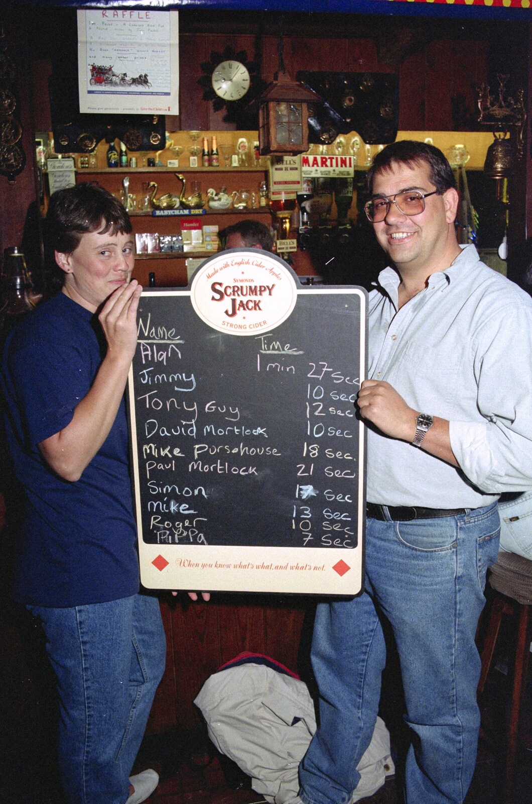 Pippa and Roger hold up the results list from A Welly Boot of Beer at the Swan Inn, Brome, Suffolk - 15th June 1996