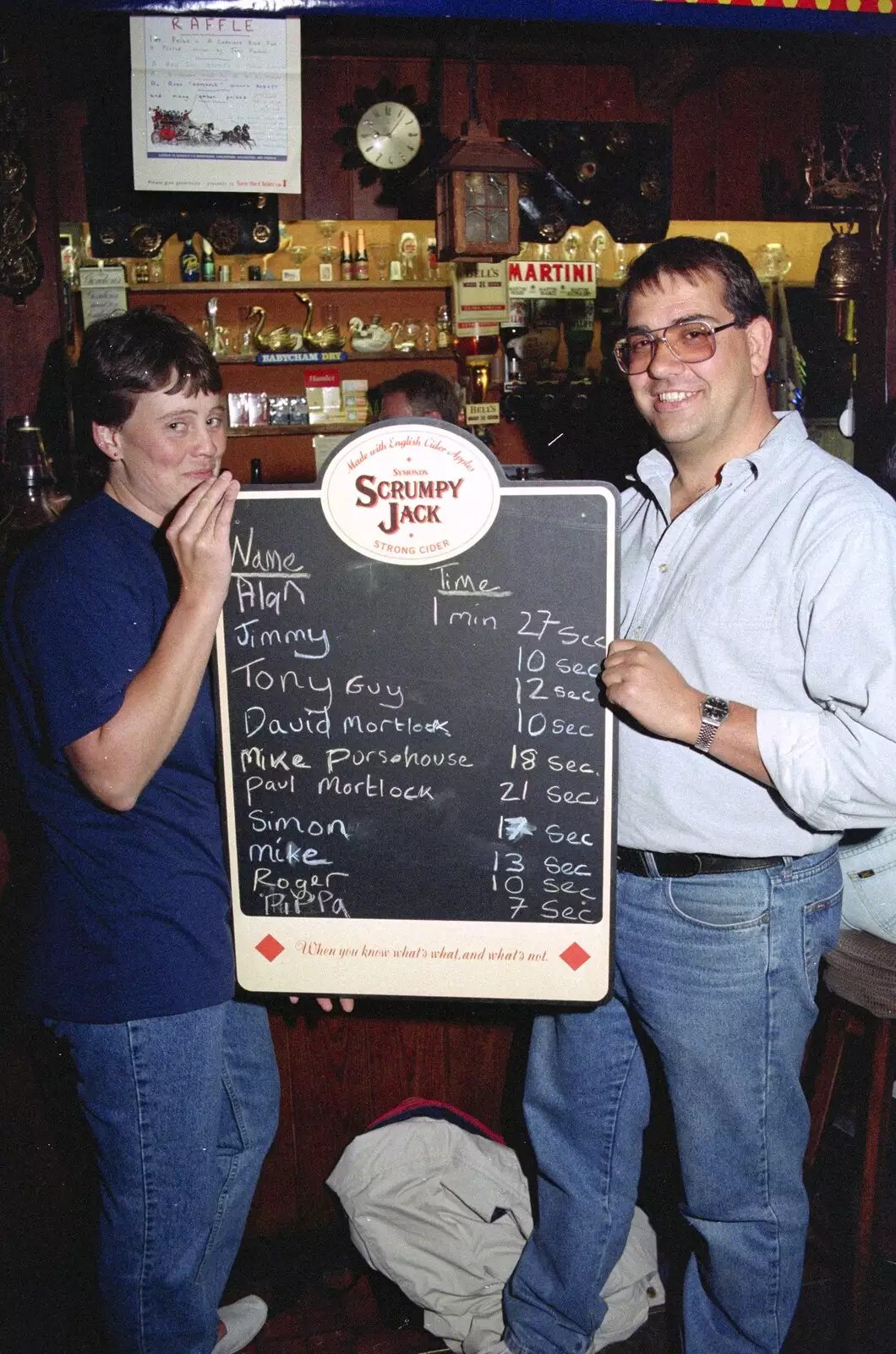 Pippa and Roger hold up the results list, from A Welly Boot of Beer at the Swan Inn, Brome, Suffolk - 15th June 1996