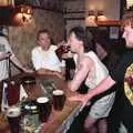 Jimmy starts the boot, as Ian starts the stopwatch, A Welly Boot of Beer at the Swan Inn, Brome, Suffolk - 15th June 1996