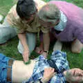 Pippa applies dock leaf to a nettle sting, DH's Barbeque at The Swan Inn, Brome, Suffolk - July 14th 1996