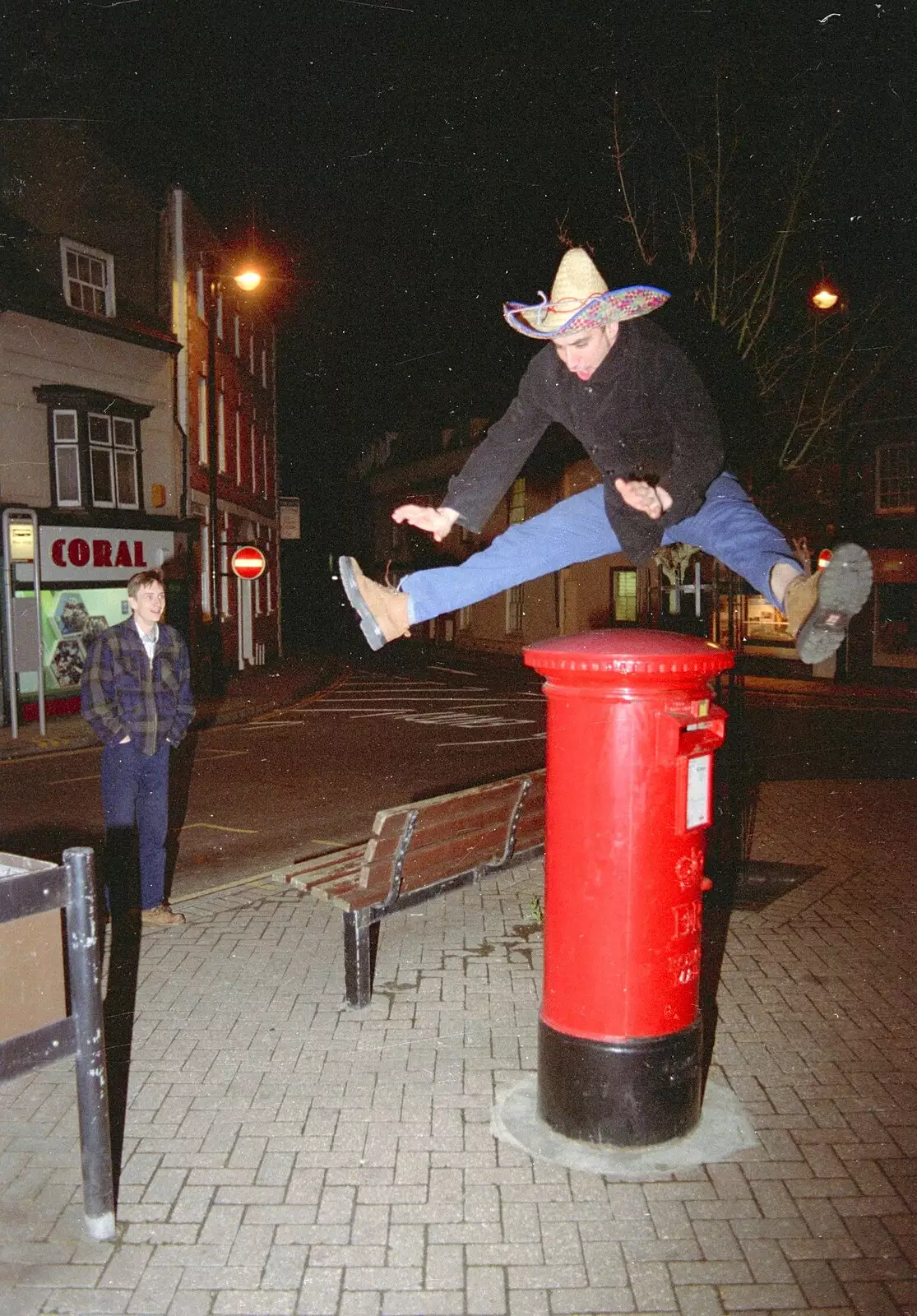 Orhan leaps over a pillar box, from A CISU Night at Los Mexicanos Restaurant, Ipswich - 15th December 1996