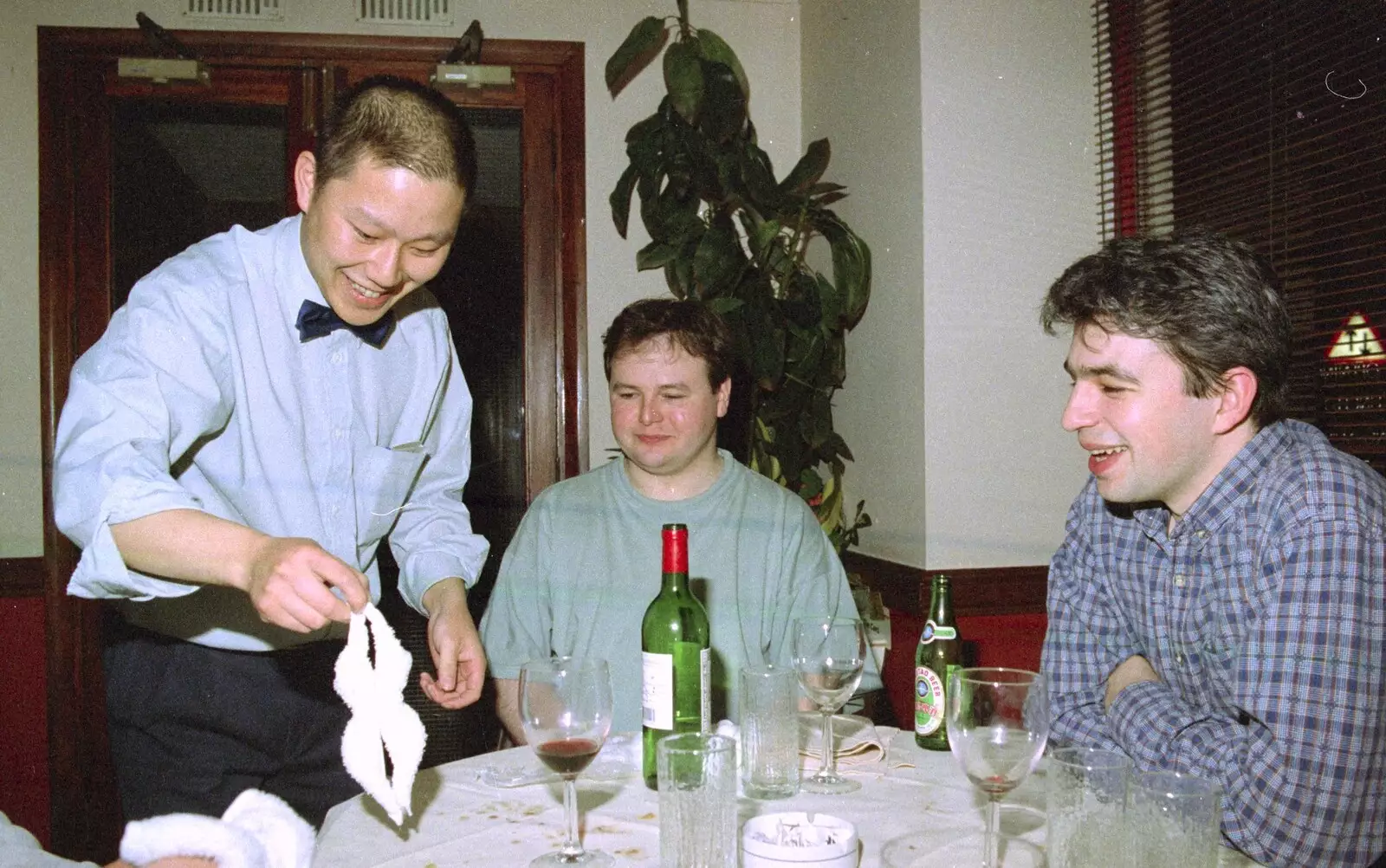 The waiter makes a chicken shape, from CISU: A Chinese Restaurant and SCC Sports Day, Ipswich and Norwich - 1st May 1997