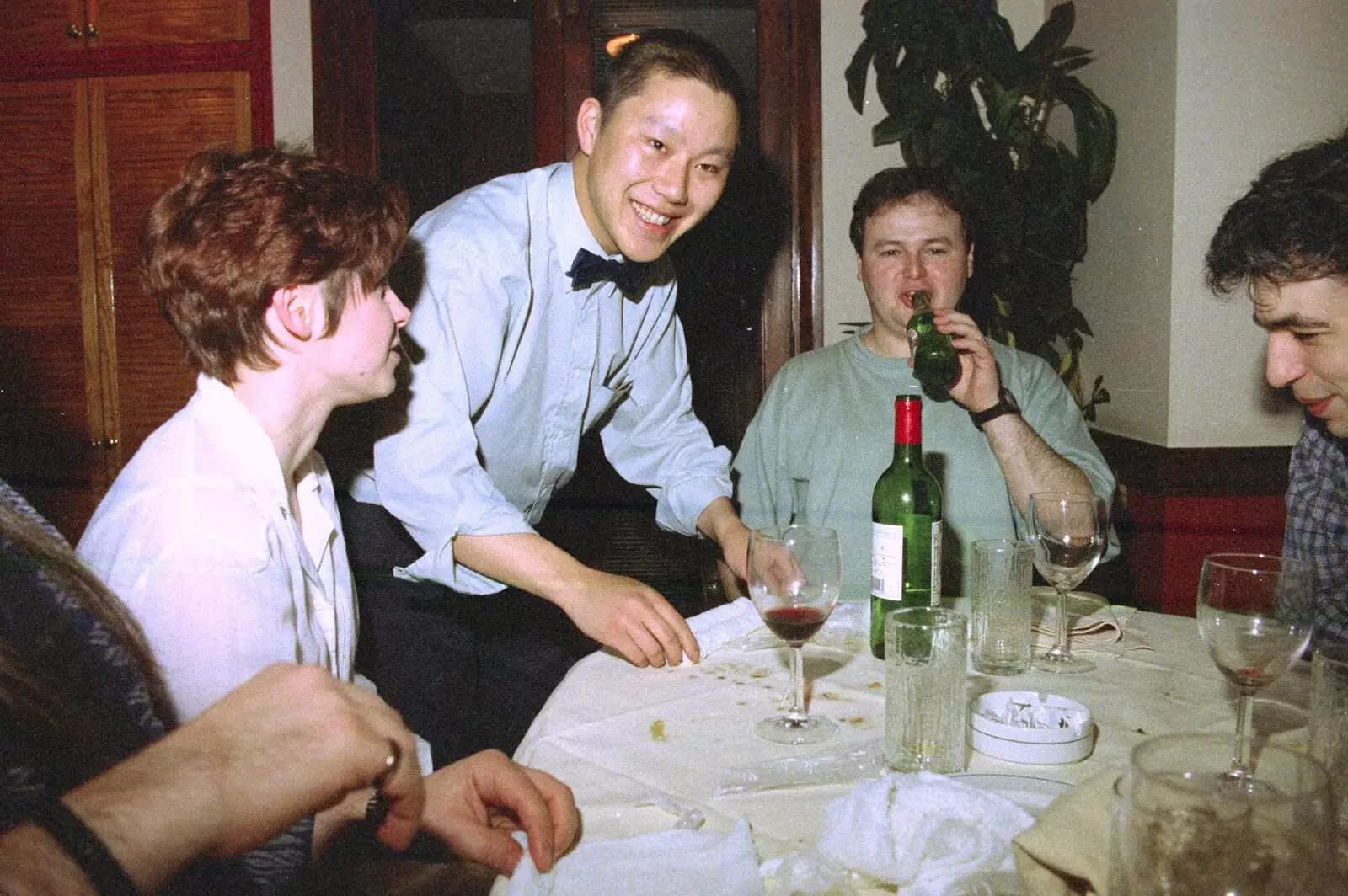 The waiter shows us a trick with towels, from CISU: A Chinese Restaurant and SCC Sports Day, Ipswich and Norwich - 1st May 1997