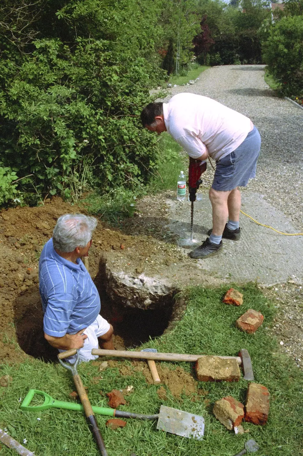 Danny Flint drills a hole in the well cap, from Hale-Bopp and Bedroom Demolition, Brome, Suffolk - 10th May 1997