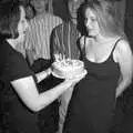 Katherine hands Lorraine her birthday cake, Lorraine's 18th and Claire's 21st, The Swan Inn, Brome, Suffolk - 11th June 1997