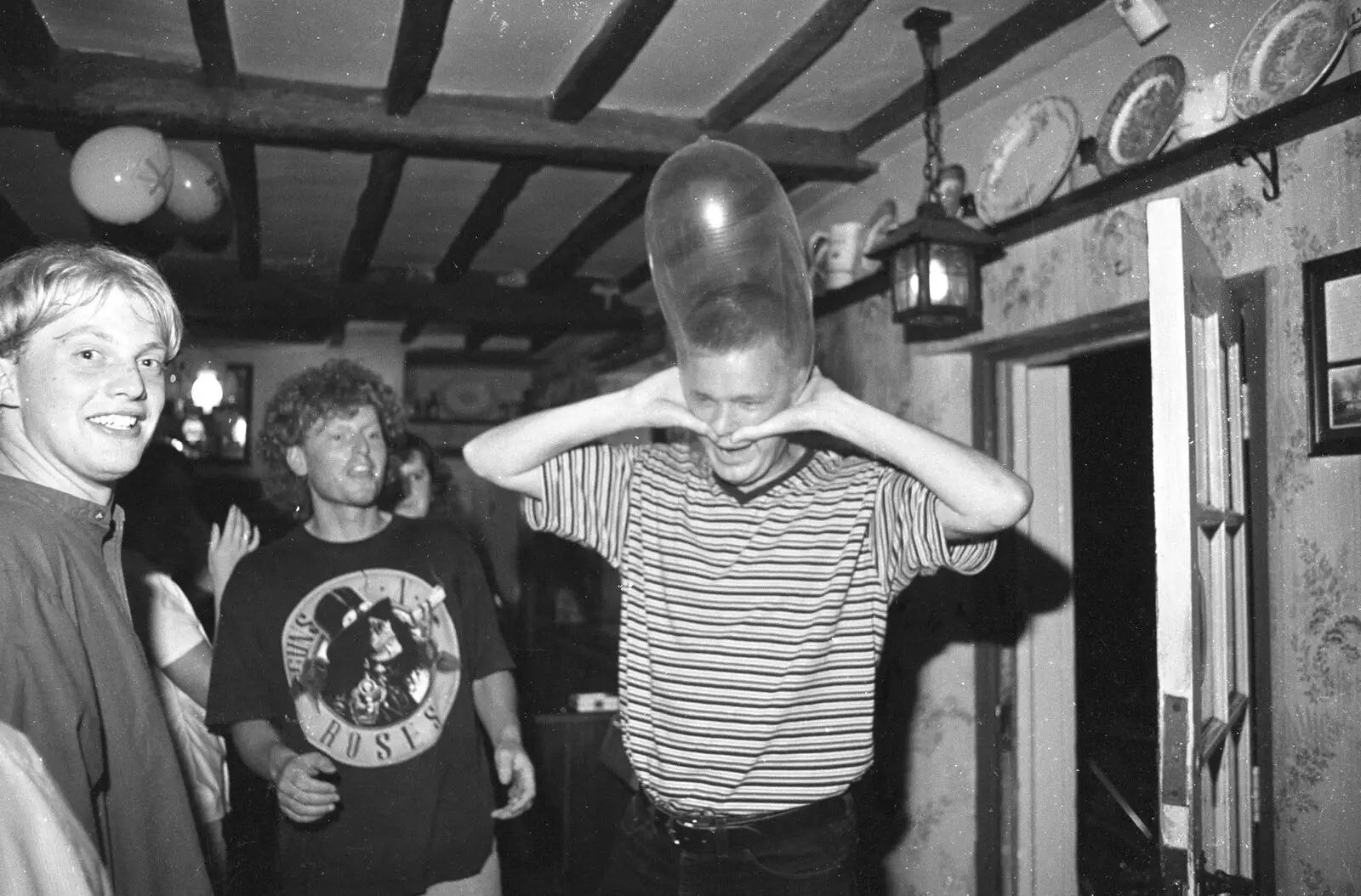 Nosher does the old 'condom-on-head-inflation' thing, from Lorraine's 18th and Claire's 21st, The Swan Inn, Brome, Suffolk - 11th June 1997