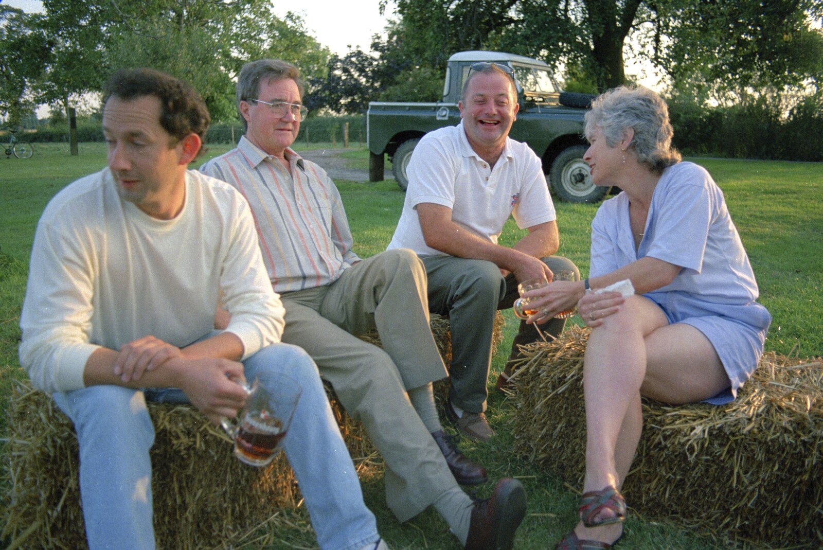DH, Peter Allen, Ian and Spammy sit on bales from Bromestock 1 and a Mortlock Barbeque, Brome and Thrandeston, Suffolk - 24th June 1997