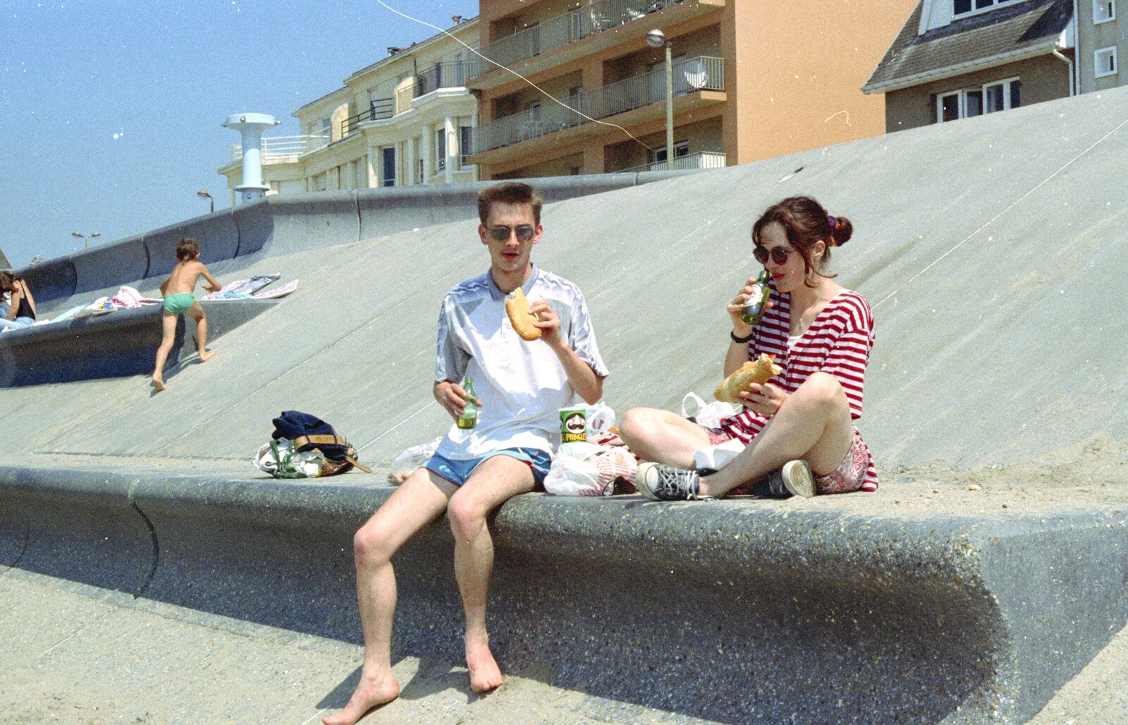 We scoff some sort of bread-based snack from A CISU Trip to Wimereux and the Swiss Rellies, France and Dorset - 6th July 1997