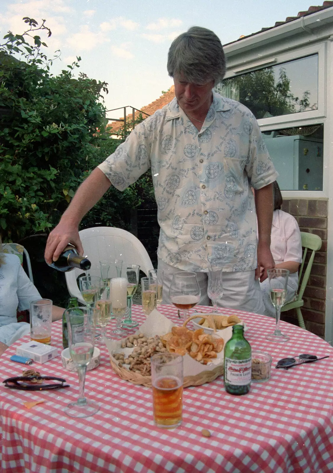 Neil pours the fizz, from A CISU Trip to Wimereux and the Swiss Rellies, France and Dorset - 6th July 1997