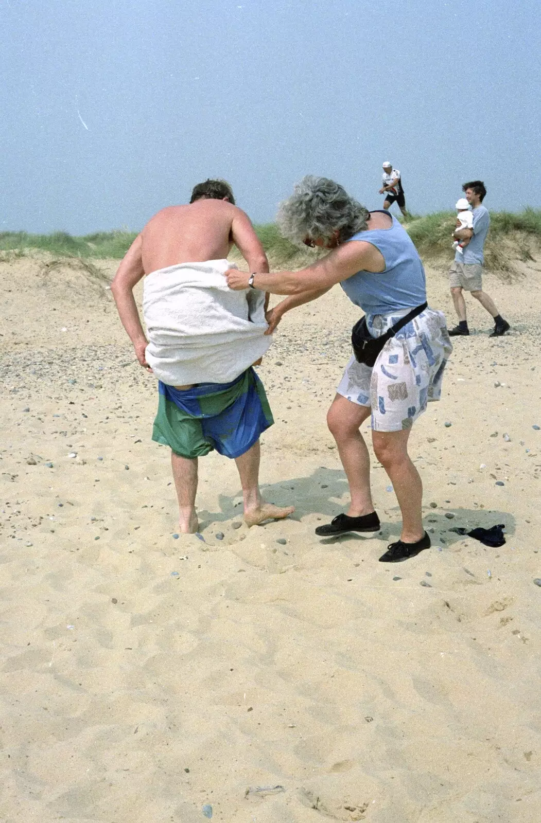 Spammy helps John Willy get changed, from BSCC at the Beach, Walberswick, Suffolk - 15th July 1997