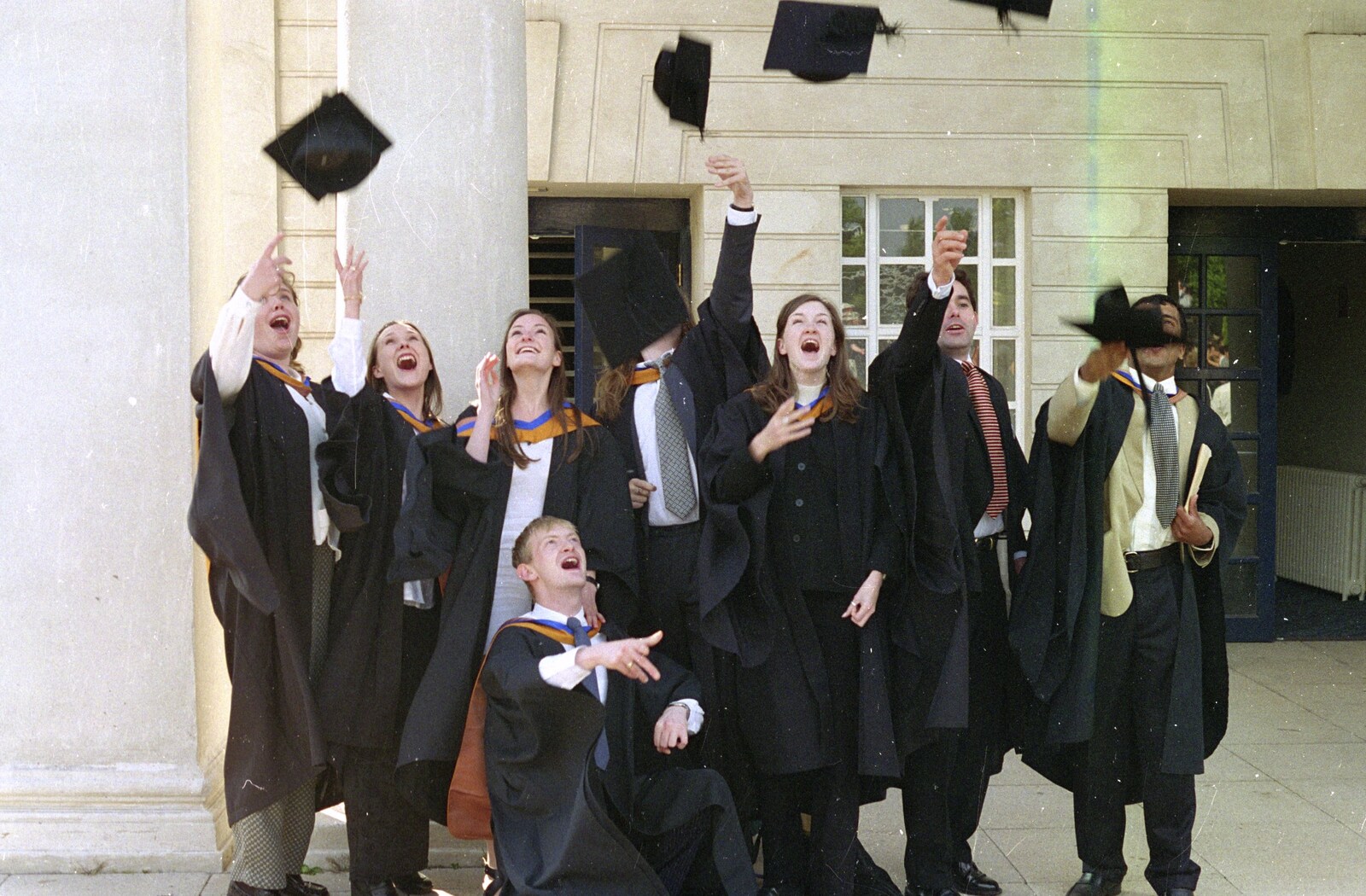 Sis Graduates from De Montfort, Leicester, Leicestershire - 9th August 1997: The traditional 'throw the mortar-boards in the air' shot