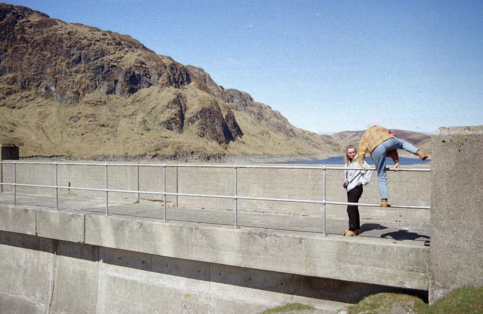 Isabelle climbs over the barrier, from A Trip to Pitlochry, Scotland - 24th March 1998