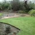 Danny digs into a pile of gravel, Garden Rotovator Action, Brome, Suffolk - 28th March 1998