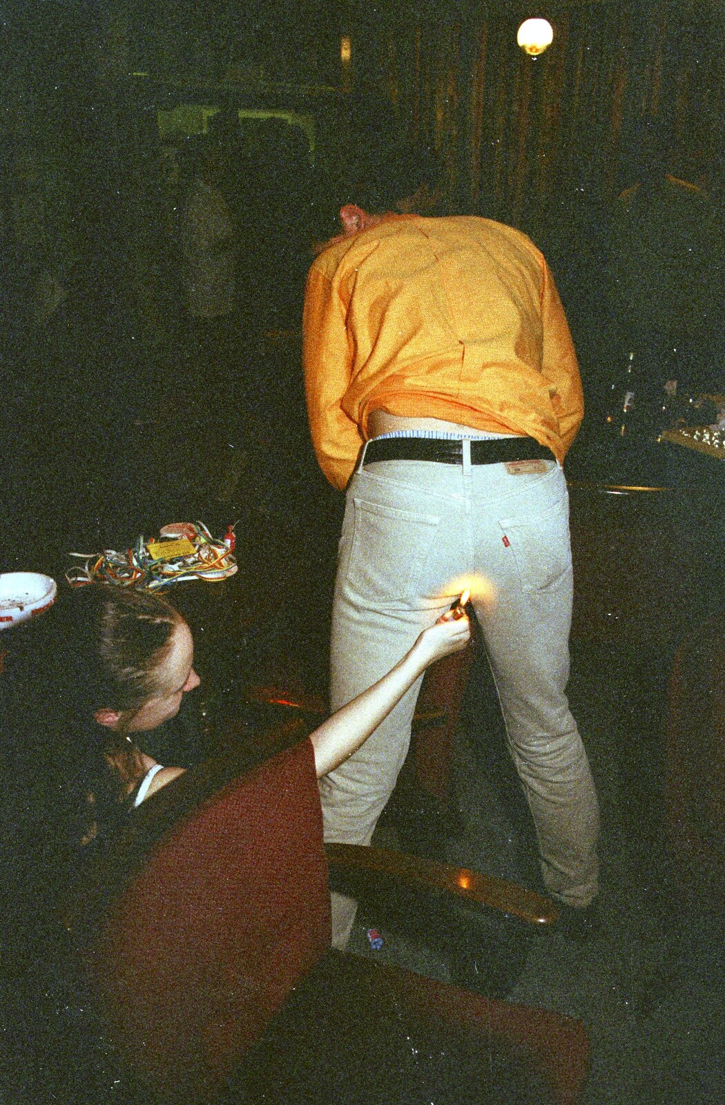 Elen tries to light John Segger's fart from A CISU Thrash in the SCC Social Club, Rope Walk, Ipswich - 4th April 1998