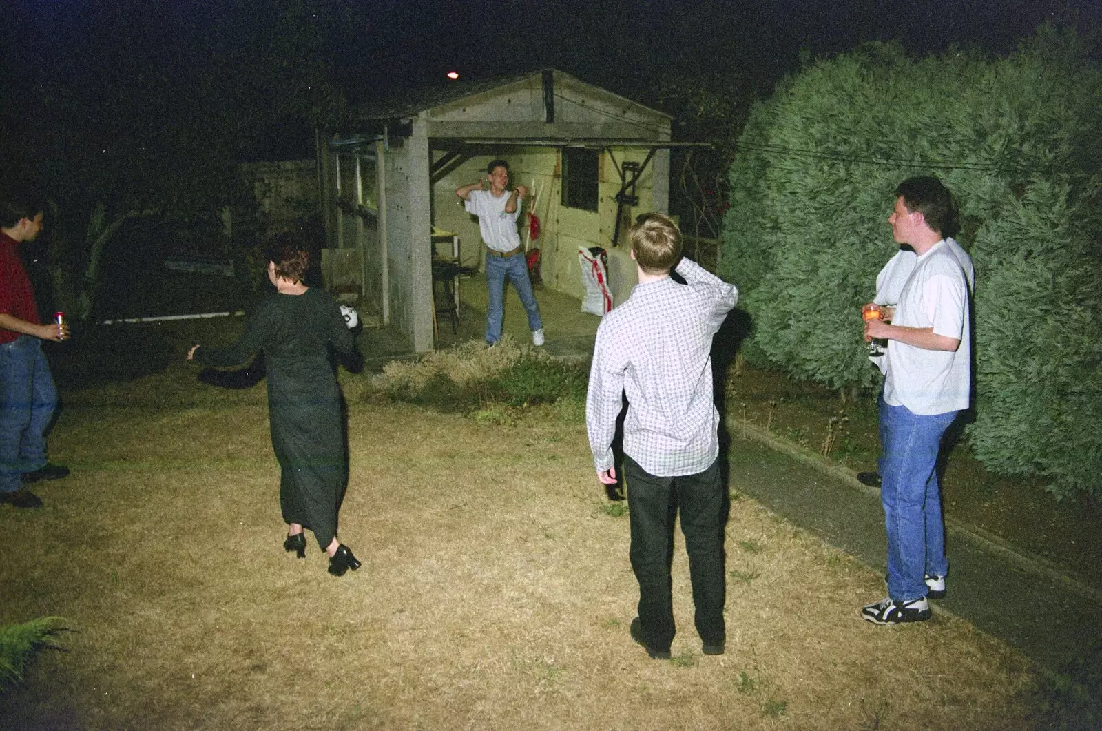 There are odd goings on in Andrew's garage, from Andrew's CISU Party, and Nosher's Garden Barbeque, Ipswich and Brome, Suffolk - June 10th 1998