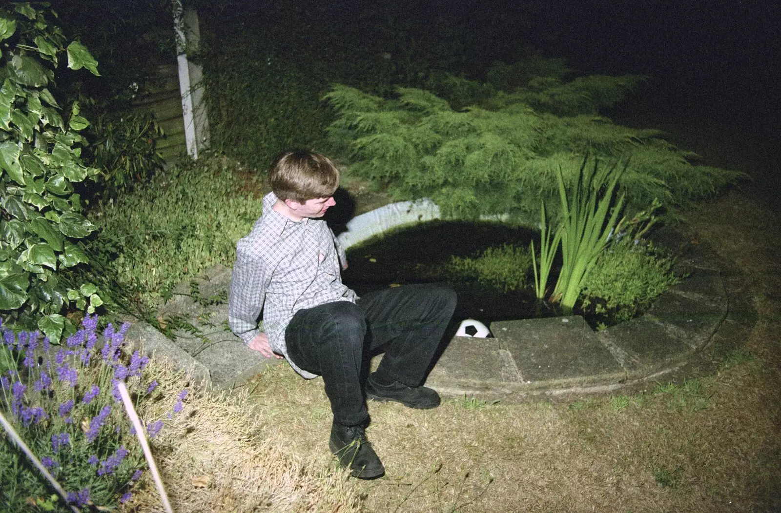 Paul fishes the football out of the pond, from Andrew's CISU Party, and Nosher's Garden Barbeque, Ipswich and Brome, Suffolk - June 10th 1998