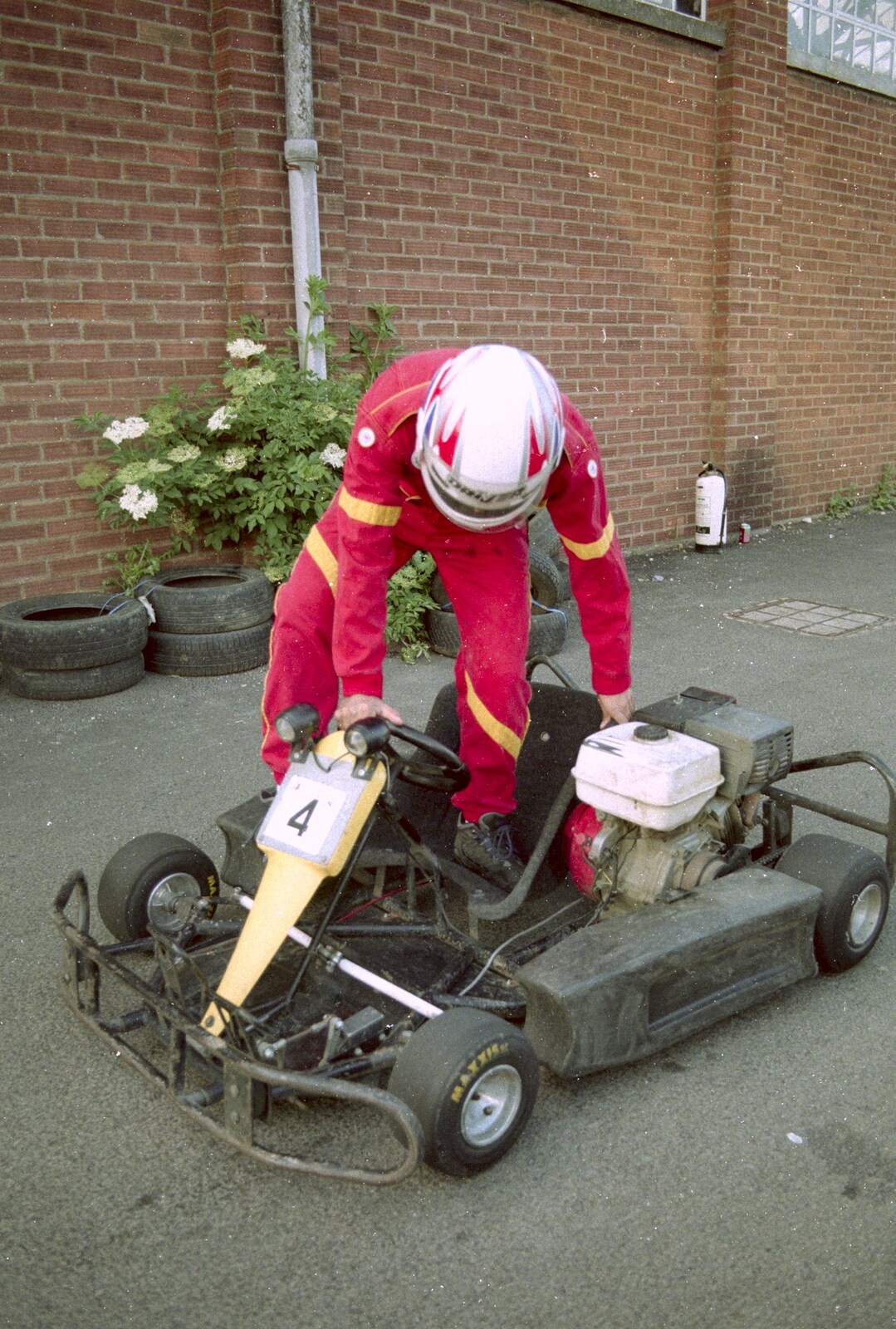 Climbing into a go-kart from Hamish's Wine and CISU Go-Karting, Caxton, Cambridge - 23rd June 1998