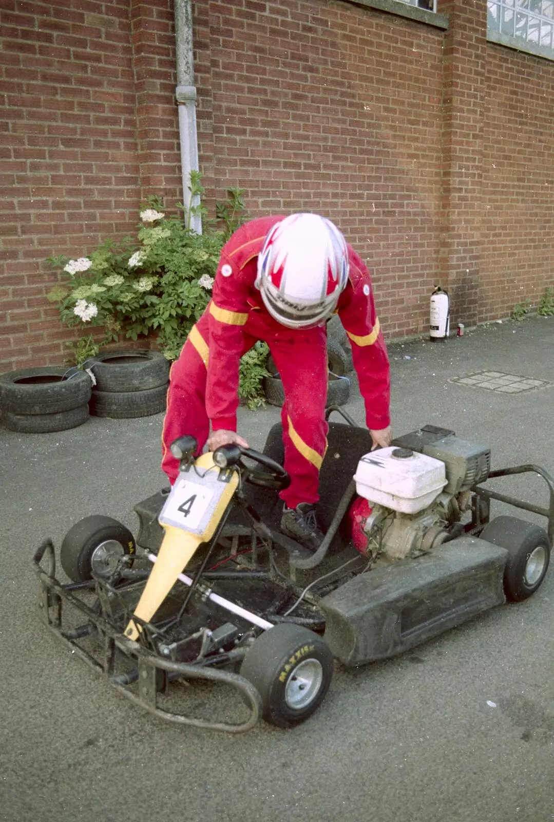 Climbing into a go-kart, from Hamish's Wine and CISU Go-Karting, Caxton, Cambridge - 23rd June 1998