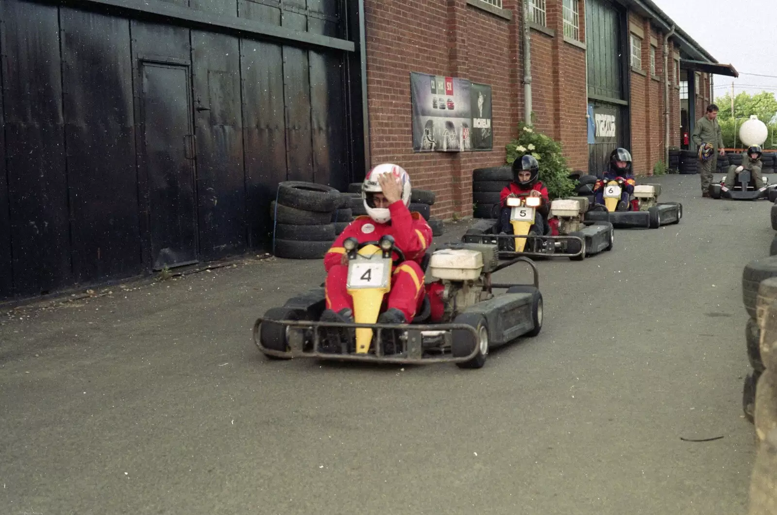 Raj gets helmeted up and trundles off, from Hamish's Wine and CISU Go-Karting, Caxton, Cambridge - 23rd June 1998