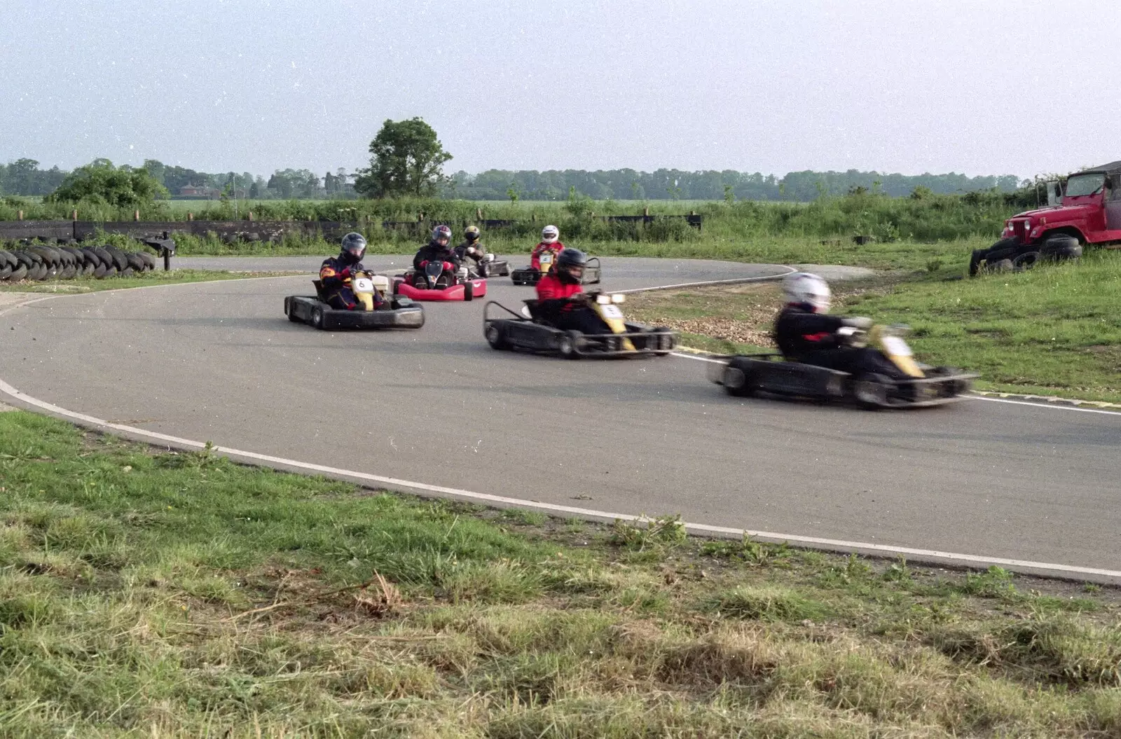 Racing through a corner, from Hamish's Wine and CISU Go-Karting, Caxton, Cambridge - 23rd June 1998