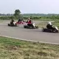 Racing through a corner, Hamish's Wine and CISU Go-Karting, Caxton, Cambridge - 23rd June 1998