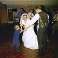 Lesley dances with a small child, Joe and Lesley's CISU Wedding, Ipswich, Suffolk - 30th July 1998
