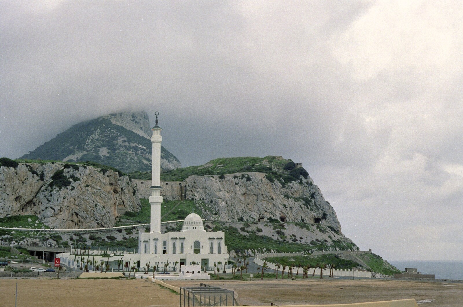 A mosque sits under misty mountains from The CISU Massive do Malaga, Spain - November 14th 1998