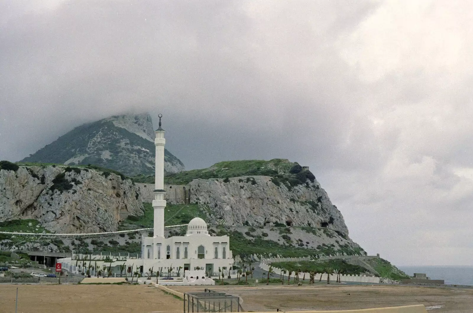 A mosque sits under misty mountains, from The CISU Massive do Malaga, Spain - November 14th 1998