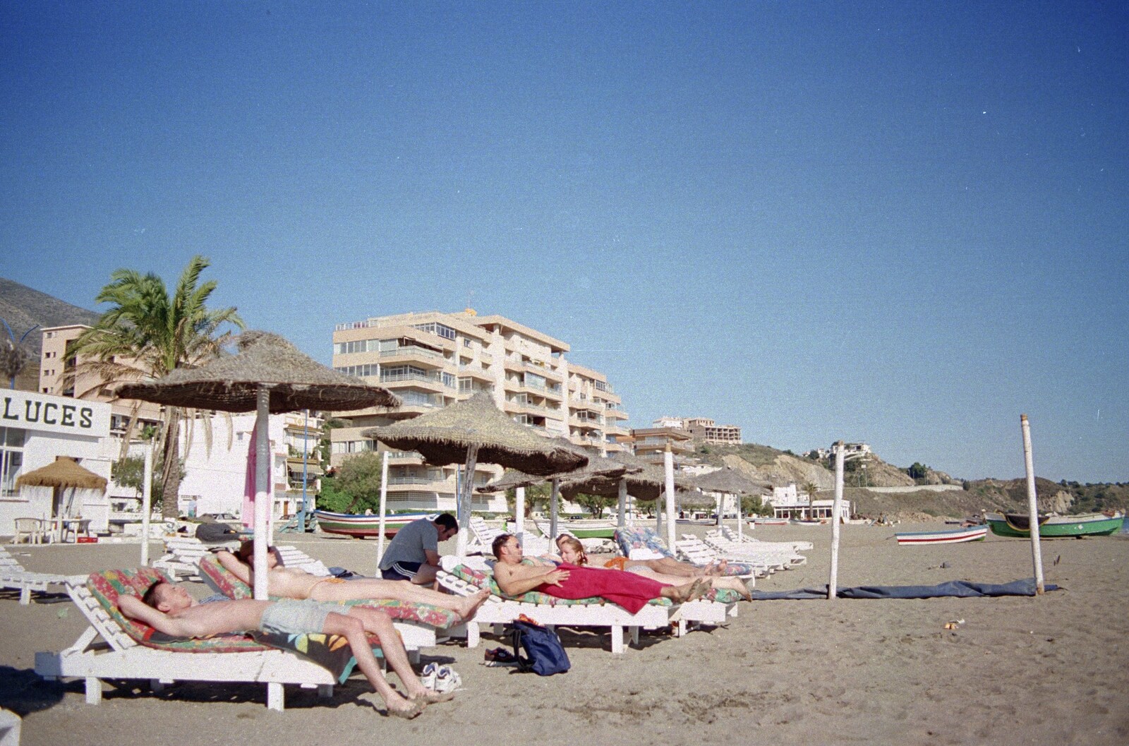 Sun loungers and thatched parasols from The CISU Massive do Malaga, Spain - November 14th 1998