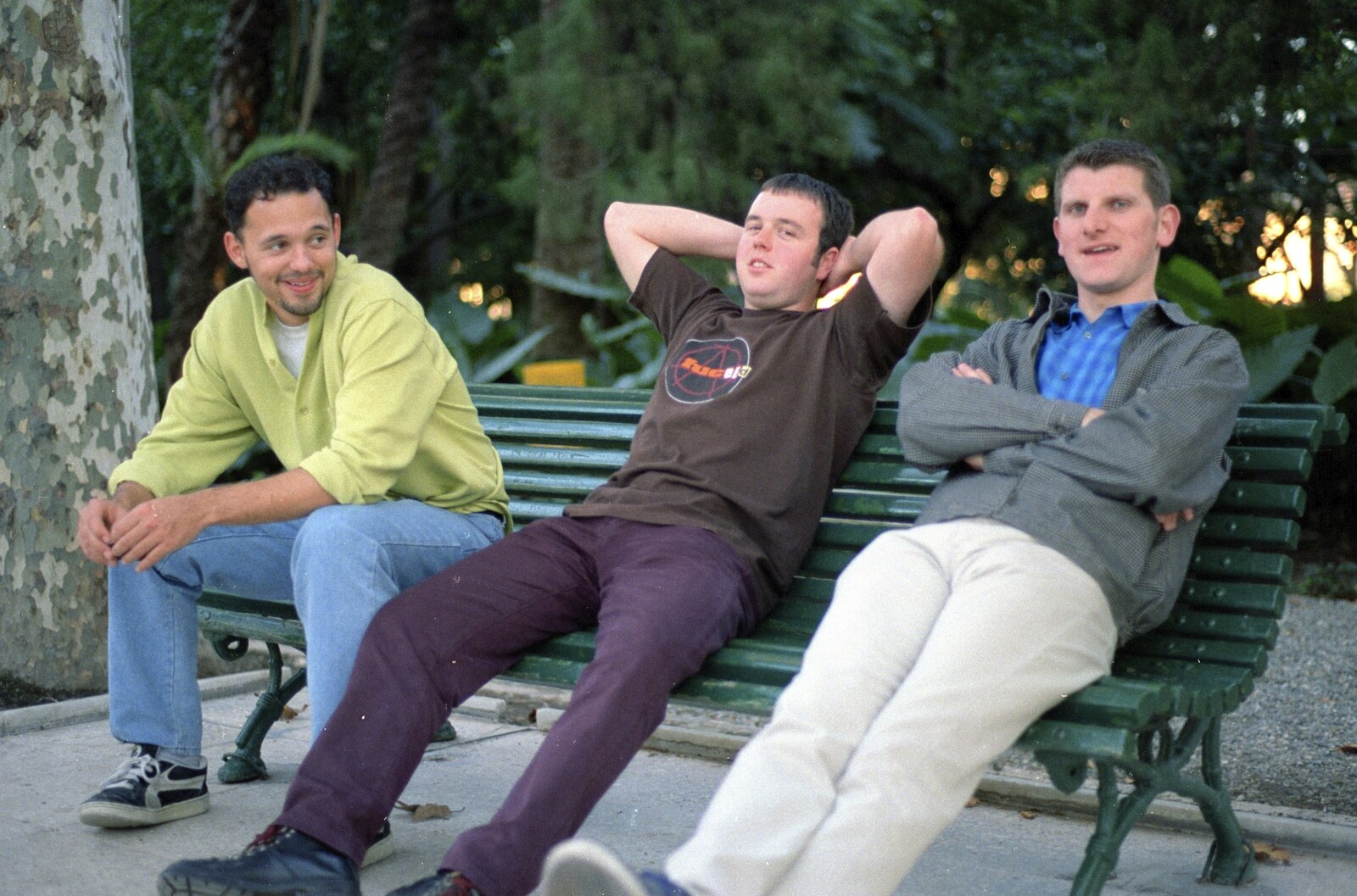 Paul, Jason and Jon on a bench from The CISU Massive do Malaga, Spain - November 14th 1998