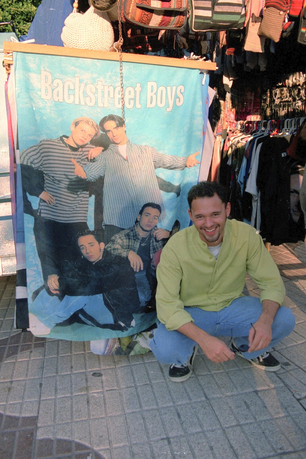 Paul poses with a Backstreet Boys poster from The CISU Massive do Malaga, Spain - November 14th 1998