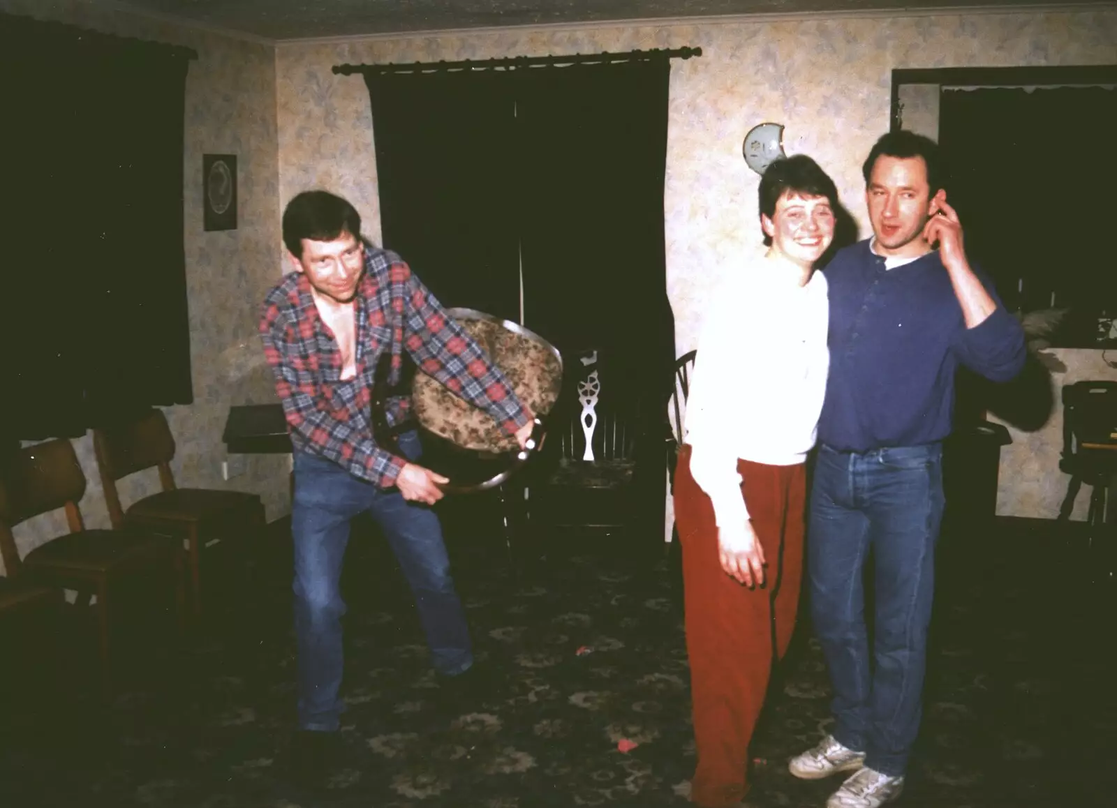 Apple picks up a chair and starts dancing with it, from Brome Swan Christmas, Suffolk - December 1998