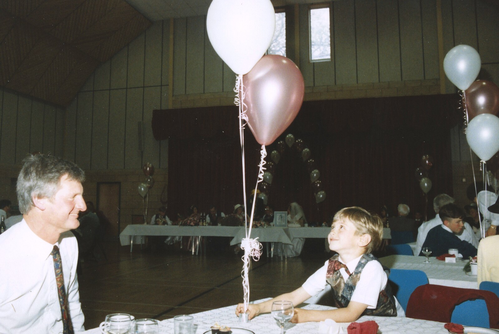 A boy with balloons from Debbie's Wedding, Suffolk - 12th June 1999