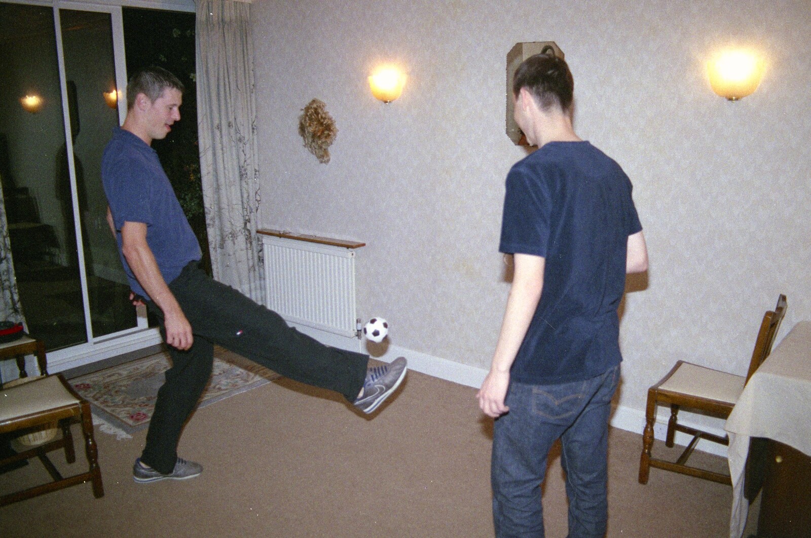There's a kickabout in the dining room from A Mortlock Barbeque and a CISU Party, Suffolk - 11th July 1999