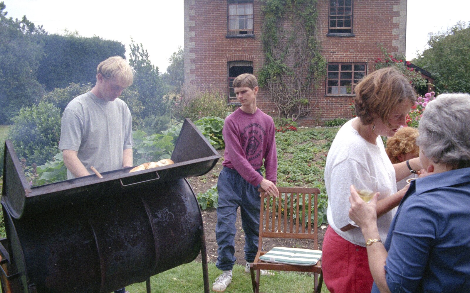 Paul mans the barbeque from A Mortlock Barbeque and a CISU Party, Suffolk - 11th July 1999