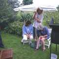 Wavy adjusts the parasol, A Mortlock Barbeque and a CISU Party, Suffolk - 11th July 1999