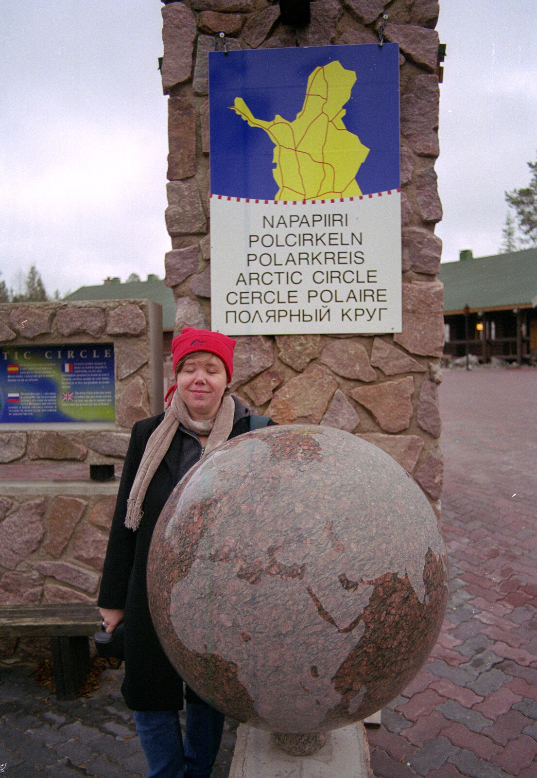 Sis stands behind a stone globe from A Trip to Rovaniemi and the Arctic Circle, Lapland, Finland - 28th November 1999
