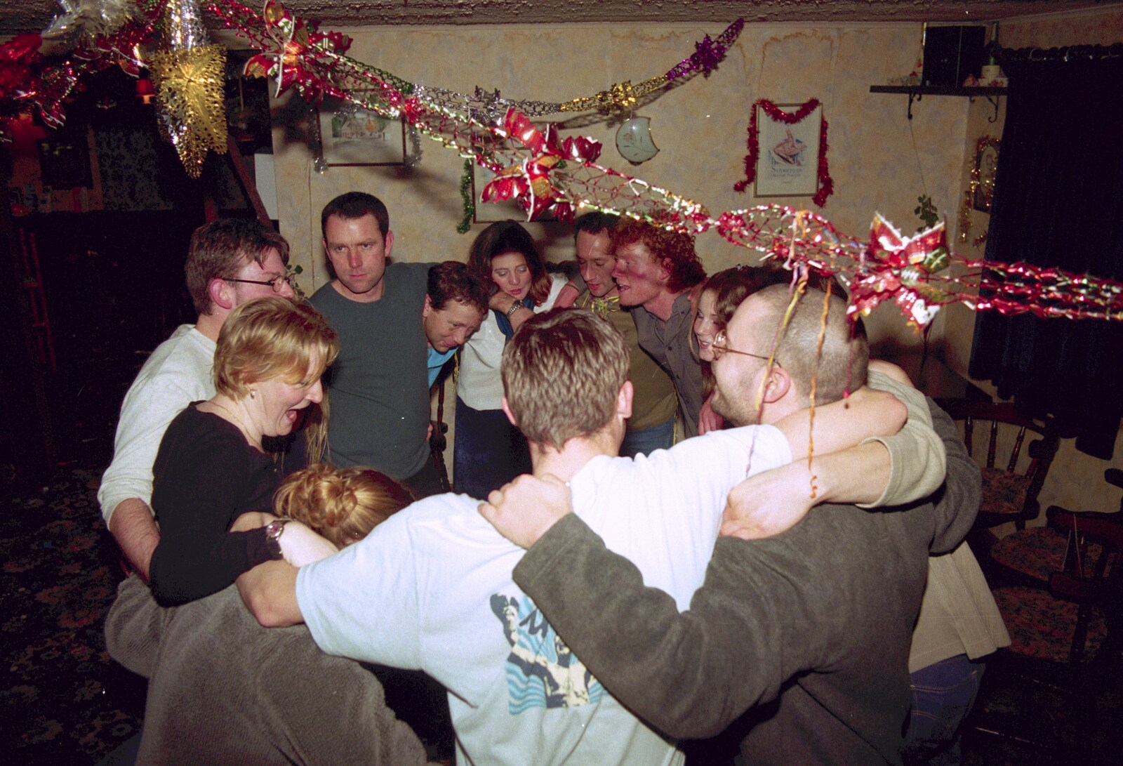 A bit of a group-hug moment from New Year's Eve at The Swan Inn, Brome, Suffolk - 31st December 1999