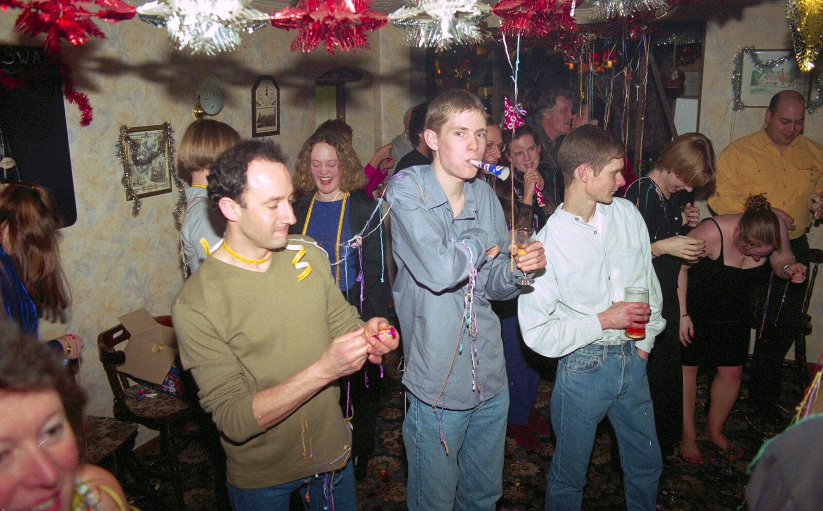 DH pulls a party popper as The Boy Phil blows a hooter from New Year's Eve at The Swan Inn, Brome, Suffolk - 31st December 1999