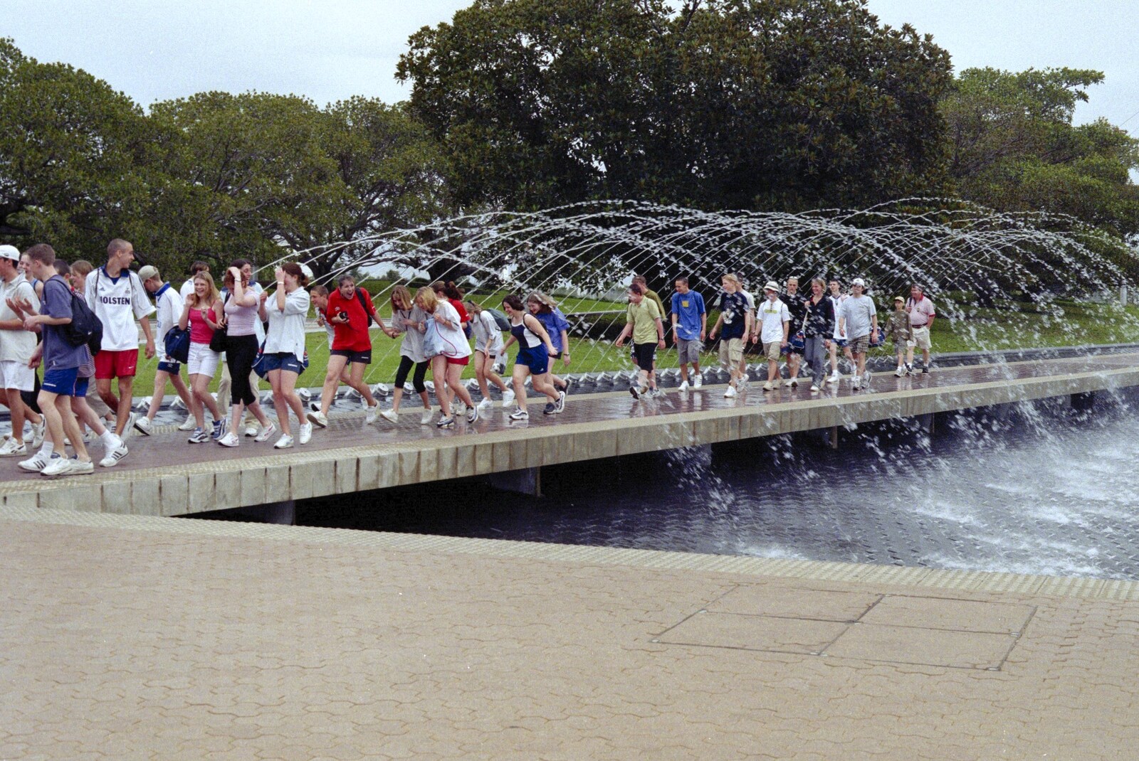 A tour group runs under some fountains from A Postcard From Hofburg Palace, Vienna, Austria - 18th April 2000