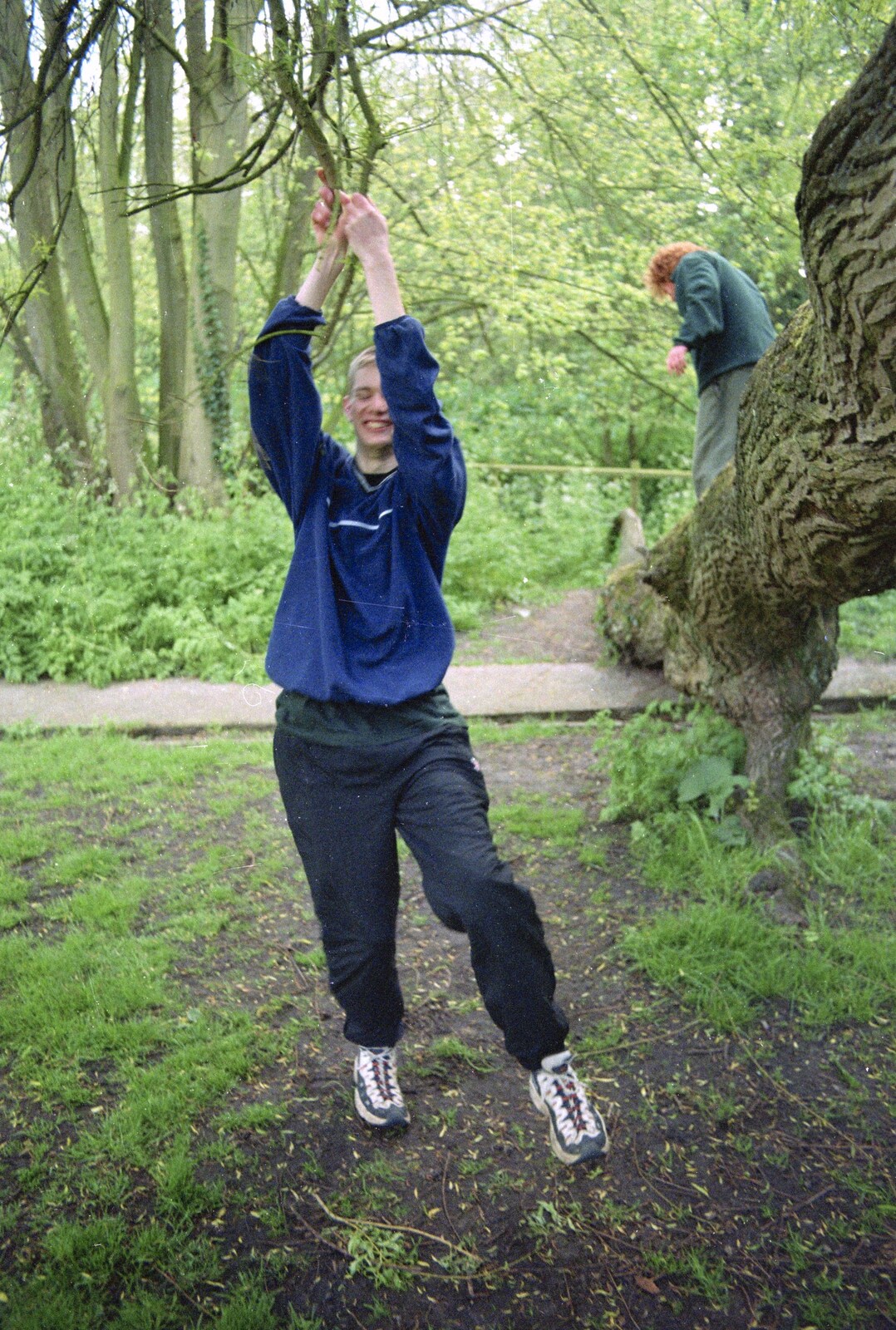 Phil swings around in the trees from A BSCC Bike Ride, Brockdish Greyhound and Hoxne Swan, Suffolk - 4th May 2000
