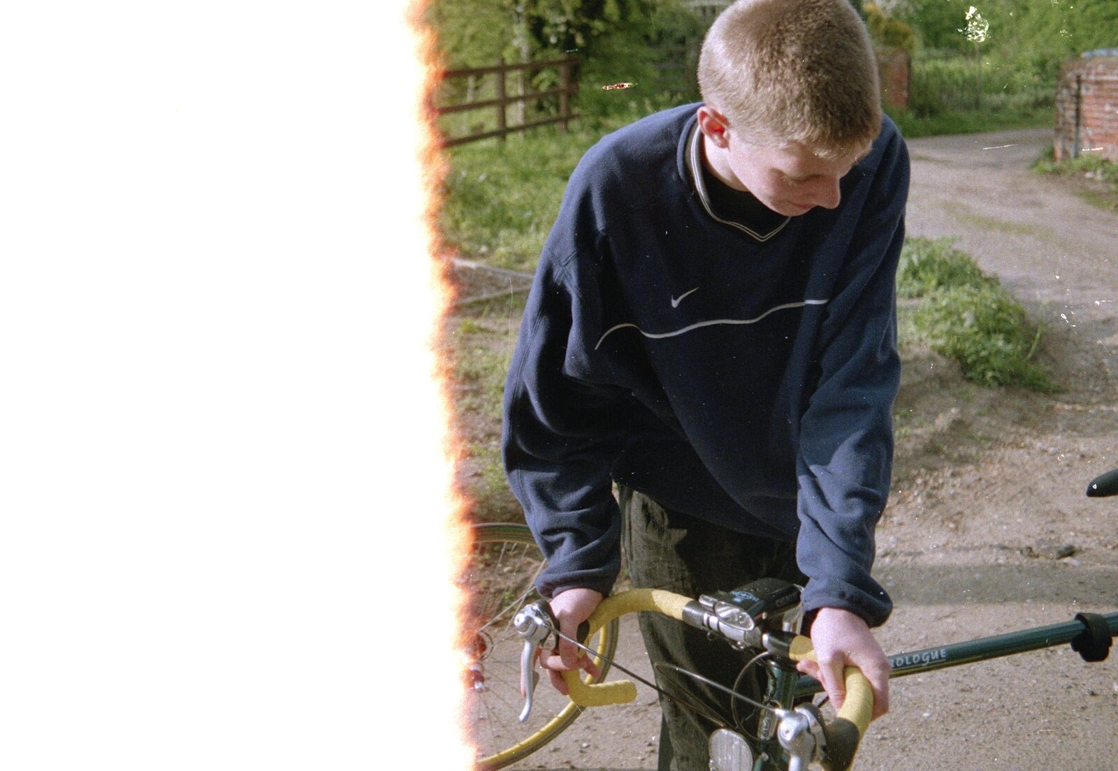 The Boy Phil gets off his bike from A BSCC Bike Ride, Brockdish Greyhound and Hoxne Swan, Suffolk - 4th May 2000