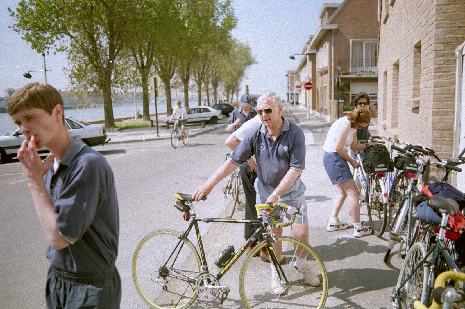 Colin hold on to DH's bike as Ninja M roams around from A BSCC Bike Ride to Gravelines, Pas de Calais, France - 11th May 2000