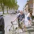 Colin hold on to DH's bike as Ninja M roams around, A BSCC Bike Ride to Gravelines, Pas de Calais, France - 11th May 2000